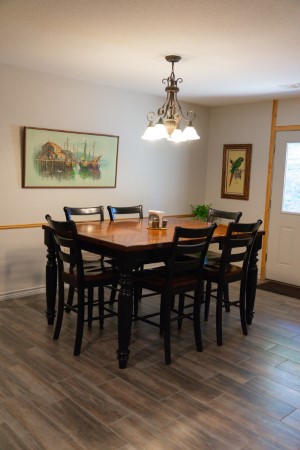 Large 6-person dining table next to the kitchen with room for every guest