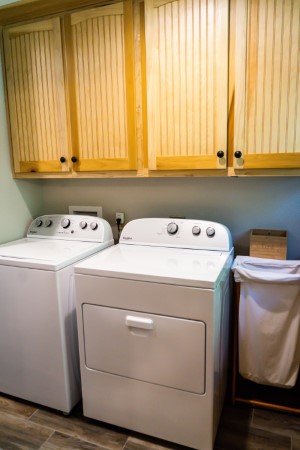 Large capacity washer and dryer Whirlpool brand in the laundry room near the kitchen area