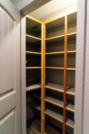 Built-in food storage pantry shelving with ample space for a weeks worth of groceries for six people